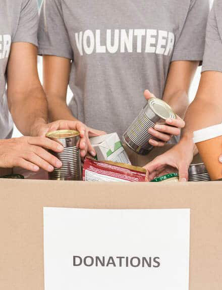 29139856-volunteers-sorting-donations